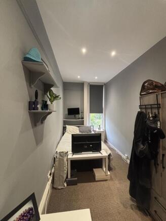 A bright and cozy living room with ample natura...