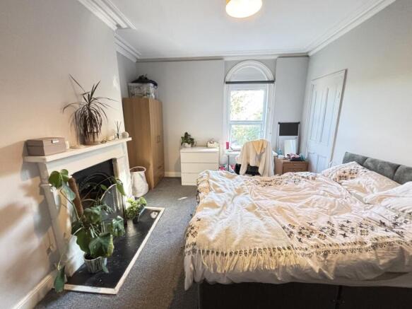 A spacious and well-maintained master bedroom f...