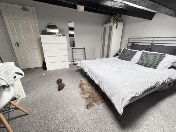 A spacious and well-maintained master bedroom f...