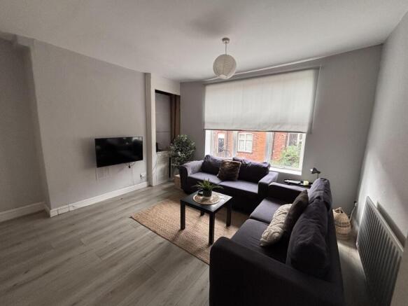 A bright and modern living room with large wind...