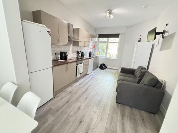 A bright and modern living room featuring a com...