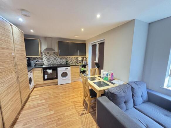 Bright and welcoming living room featuring mode...