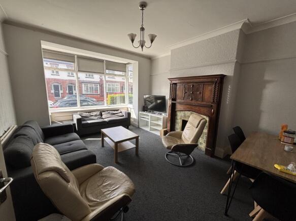 A well-lit, inviting living room featuring a mi...