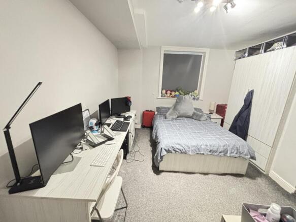 A spacious, well-maintained master bedroom feat...