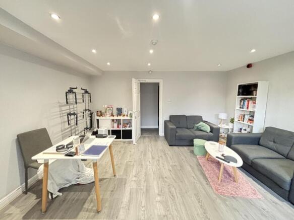 Bright and welcoming living room with modern fu...