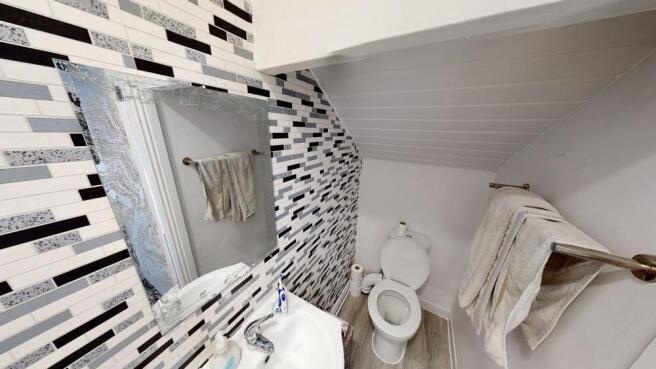 Bright and modern bathroom with ample lighting,...