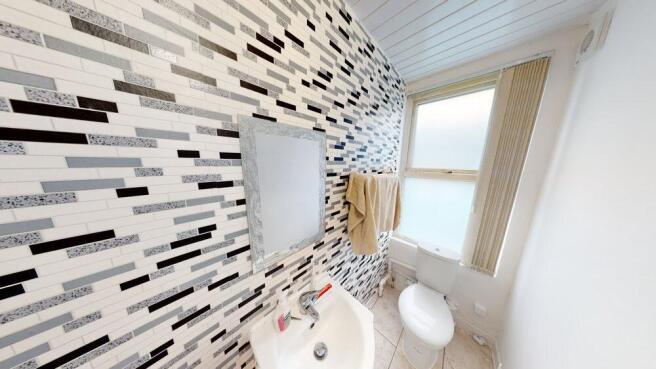 A modern, well-maintained bathroom featuring a ...
