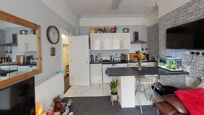 A bright and modern living room featuring conte...