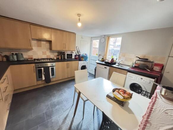 A bright and modern living room featuring ample...