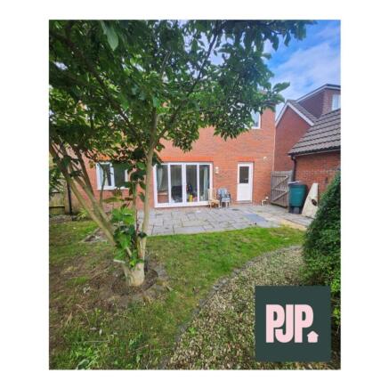 A charming garden space featuring a well-mainta...