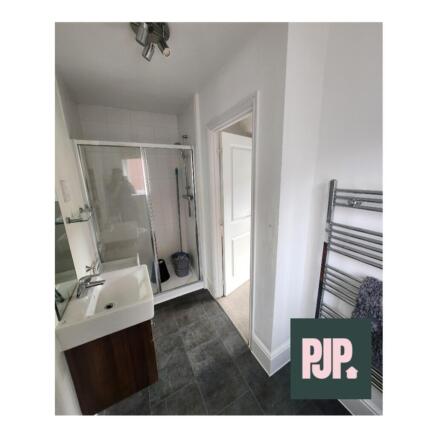 Modern bathroom featuring a spacious walk-in sh...