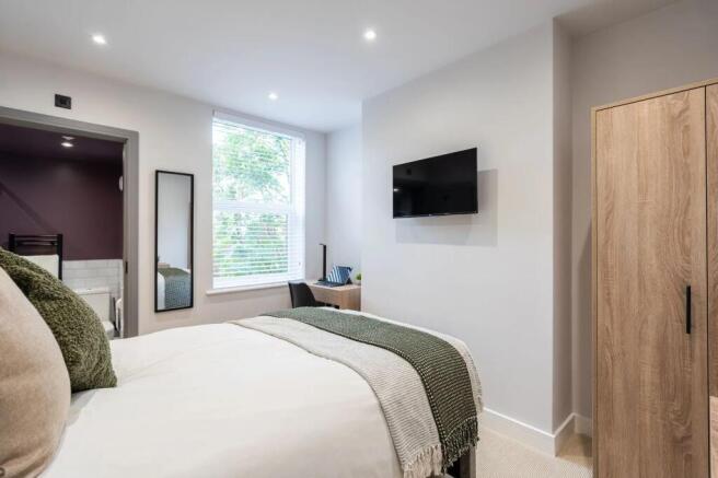 Bright and modern living room with large window...