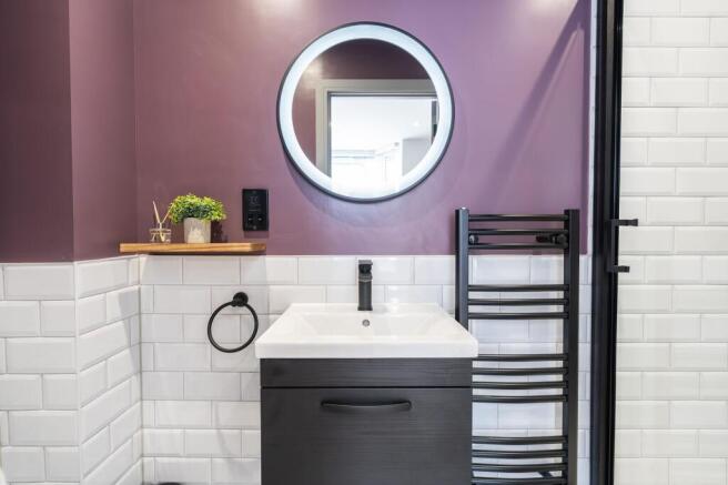 Modern bathroom featuring a sleek sink with a b...