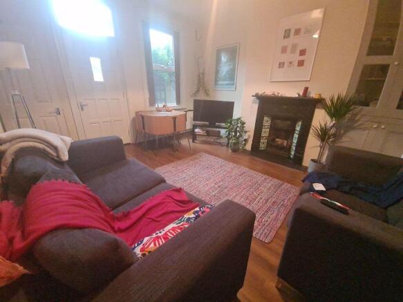 A cozy and well-maintained living room featurin...