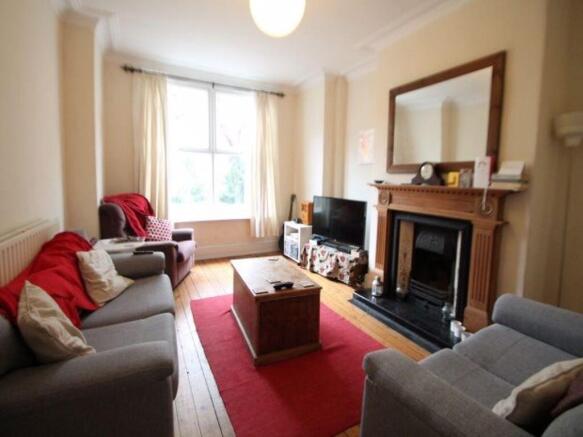 A cozy and inviting living room featuring comfo...