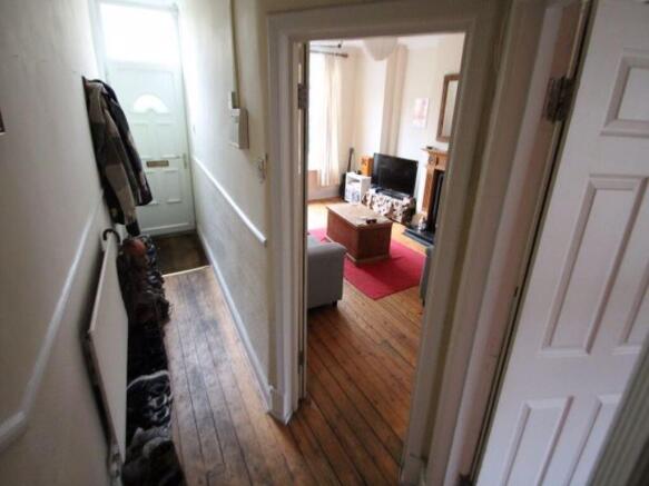 A well-lit, comfortable living room featuring m...