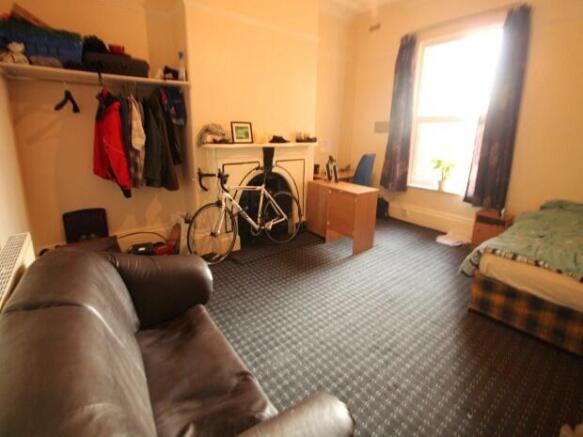 A spacious and welcoming living room featuring ...