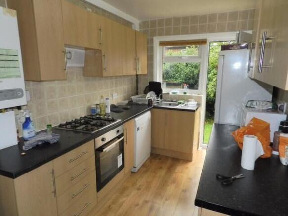 A well-maintained kitchen with ample counter sp...