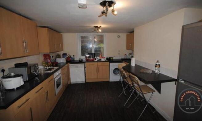 A well-equipped kitchen with ample counter spac...