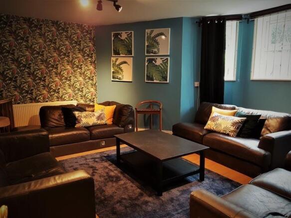 Warm, stylish living room with coordinating sof...