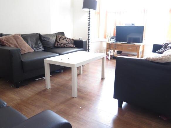 Bright and inviting living room featuring comfo...