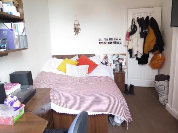 A spacious and inviting master bedroom featurin...