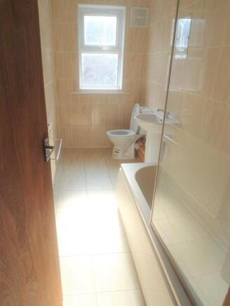 A clean and well-maintained bathroom with a sho...