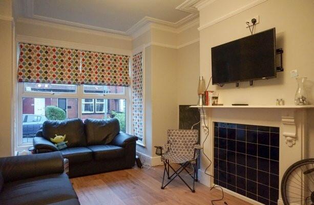 A bright and inviting living room featuring a l...