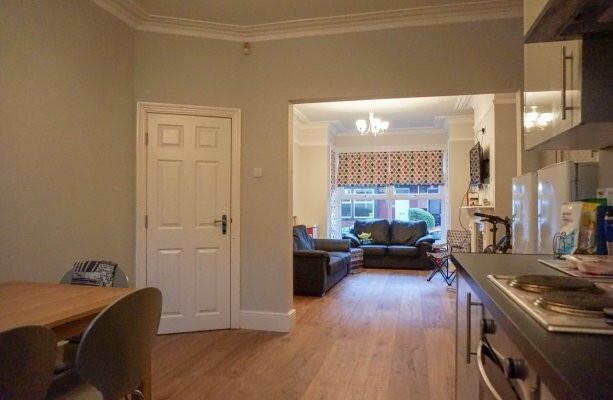 A spacious and welcoming living room featuring ...