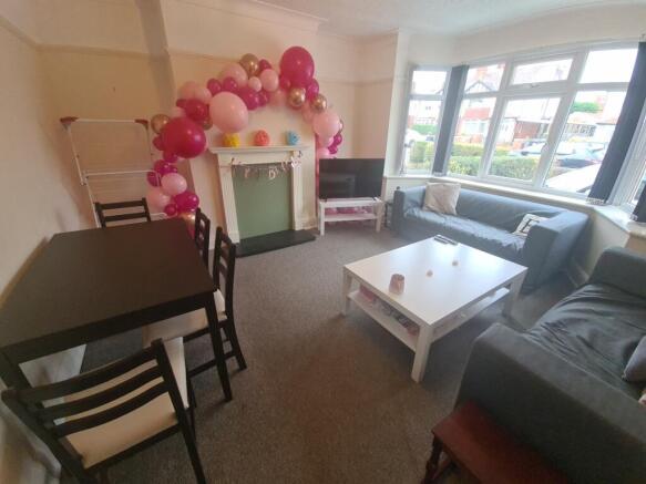 A cozy and well-maintained living room with amp...