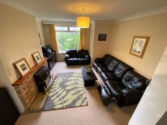 A spacious and inviting living room with a larg...