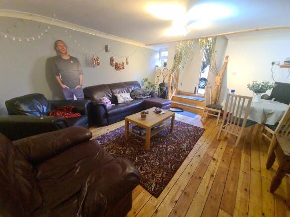 A spacious and well-maintained living room with...