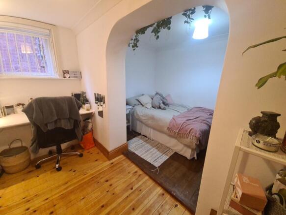 A cozy and well-maintained double bedroom featu...