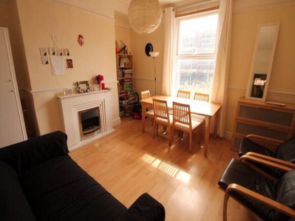 Bright and welcoming living room featuring natu...