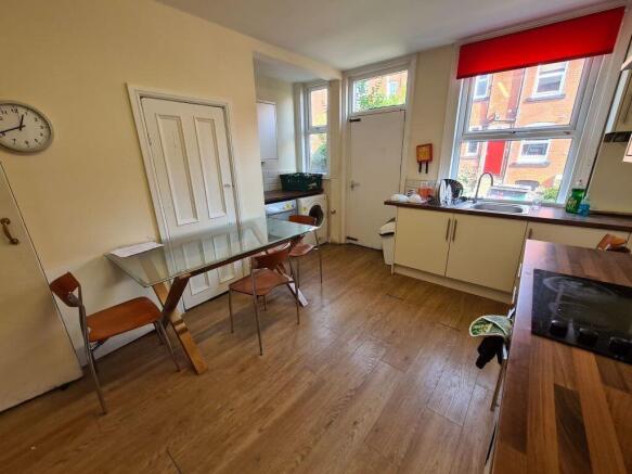 A spacious and well-lit living room featuring l...