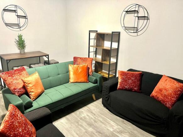 A stylish and inviting living room featuring a ...