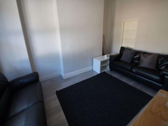 A modern and stylish living room featuring comf...