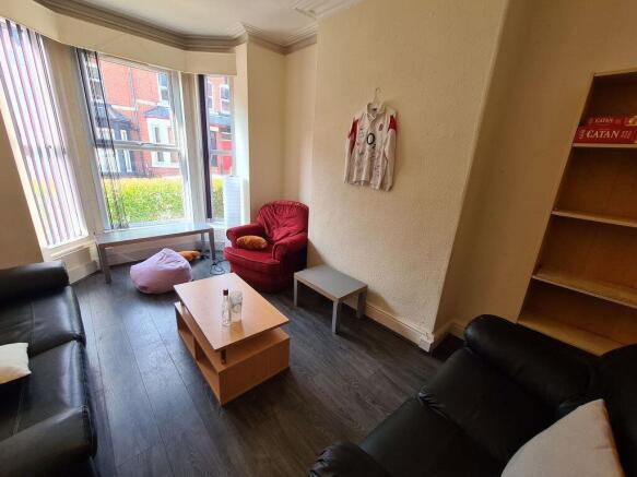 Bright and welcoming living room with ample sea...