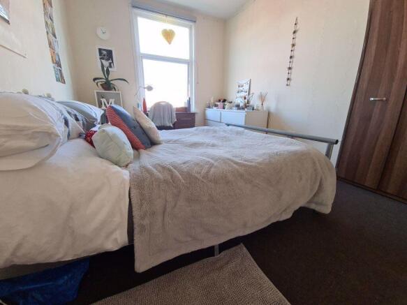 A spacious and well-maintained master bedroom f...