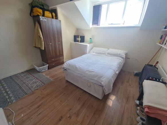 A bright and spacious master bedroom featuring ...