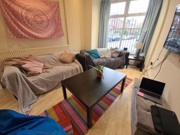 Bright and welcoming living room featuring a la...