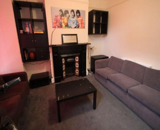 A contemporary living room featuring a large gr...