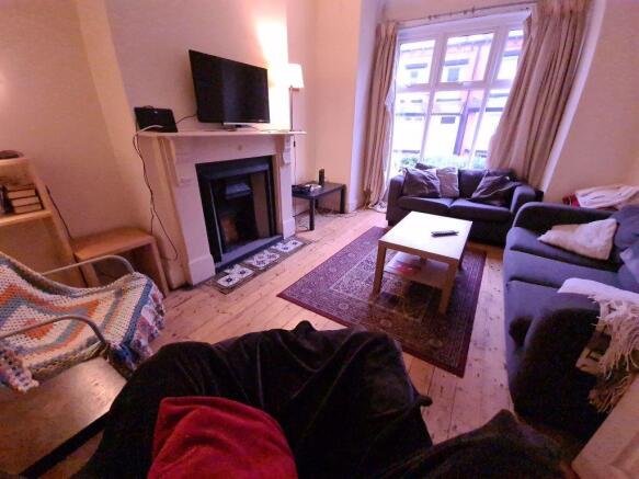 A cozy and inviting living room with comfortabl...