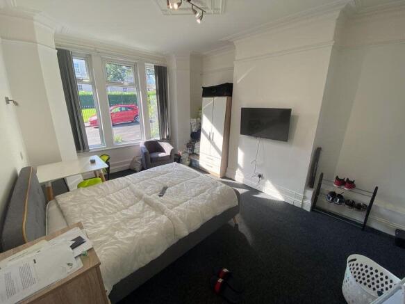 Bright and modern living room with ample natura...