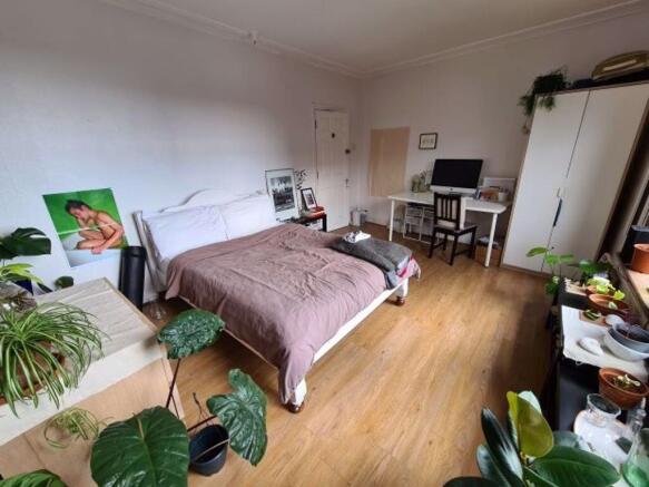 A well-lit, inviting living room with a comfort...