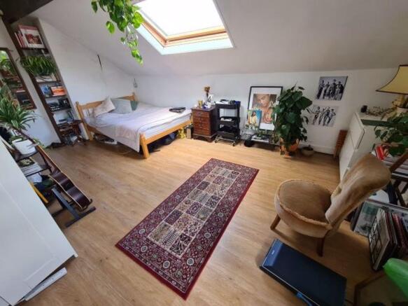 Bright and inviting living room with ample natu...