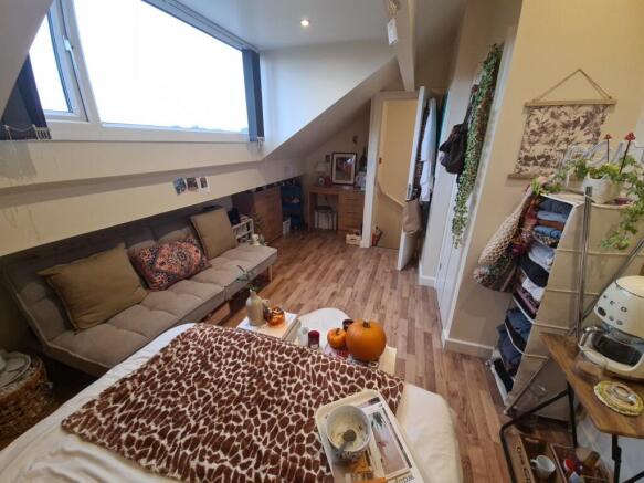 A cozy and welcoming living room filled with na...