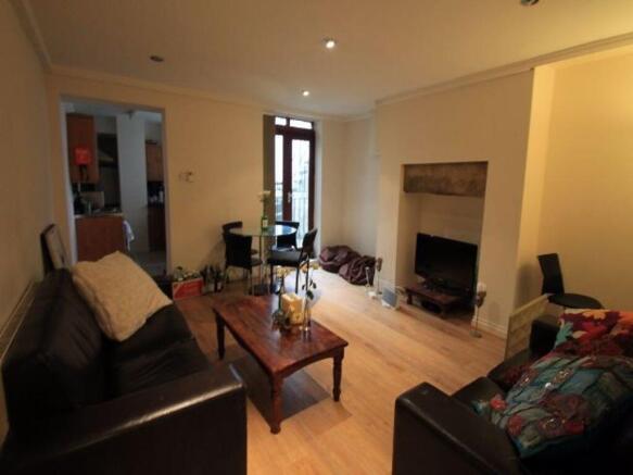 A welcoming and well-maintained living room fea...