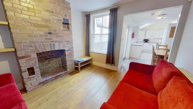 Bright and inviting living room featuring a cha...