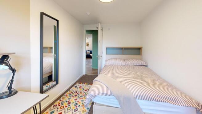 Bright and spacious master bedroom featuring a ...